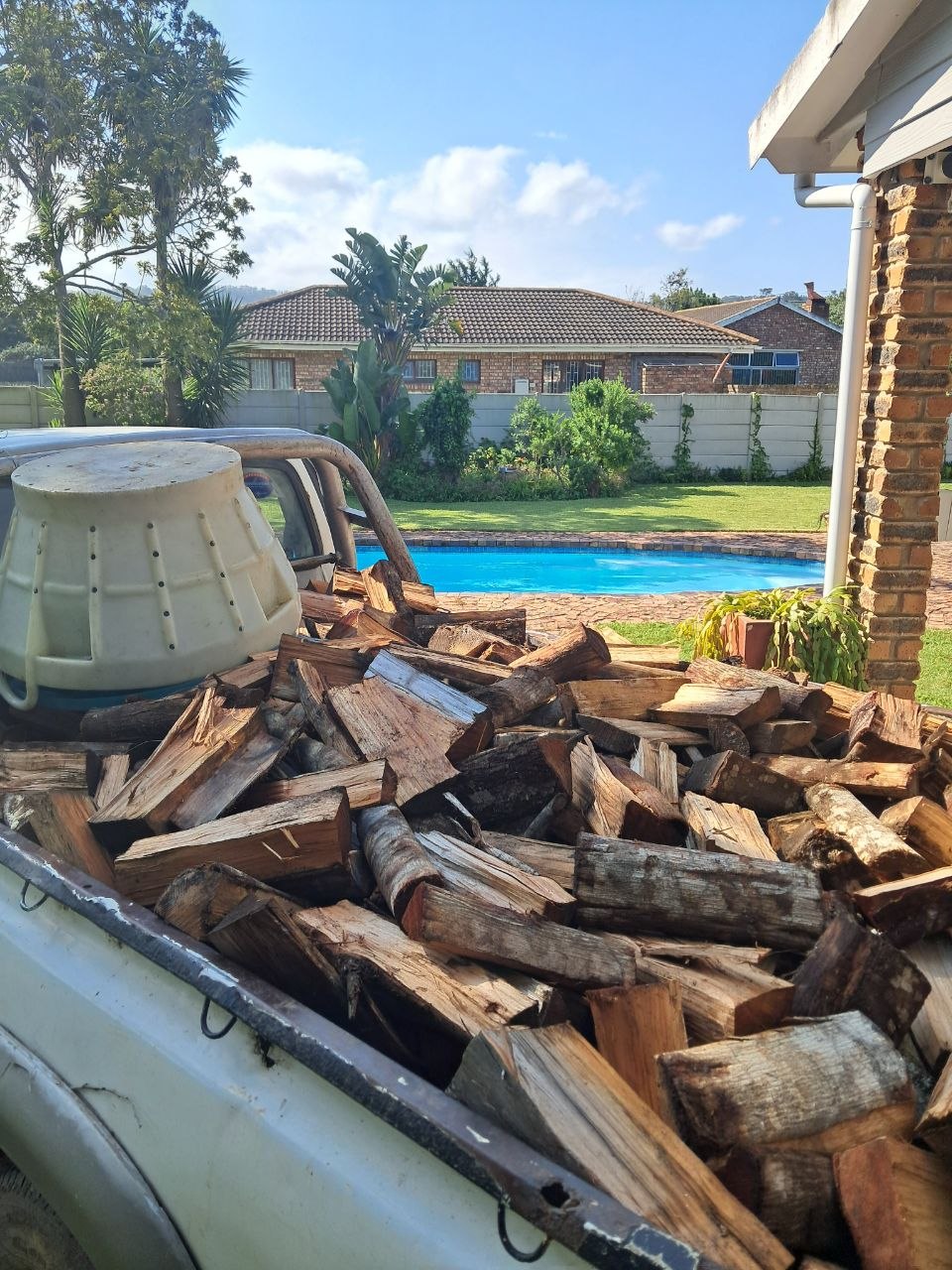 Split dry wattle logs loaded to the top of the bakkie