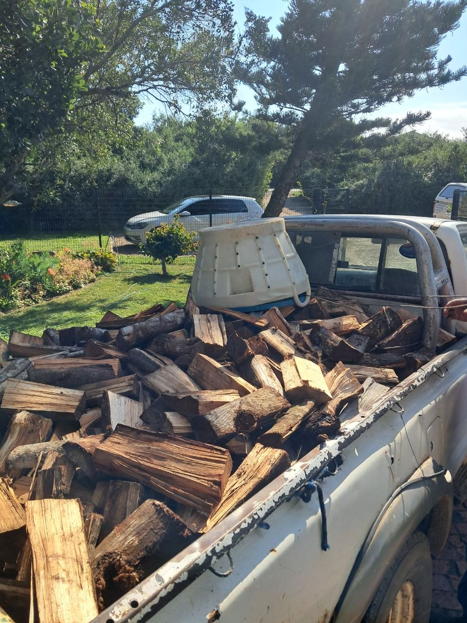 Dry wattle firewood stacked high for a Garden Route delivery